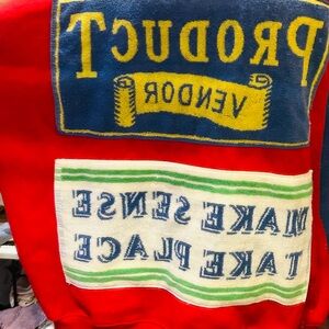 Red Graphic Sweatshirt with Blue and Yellow Accents